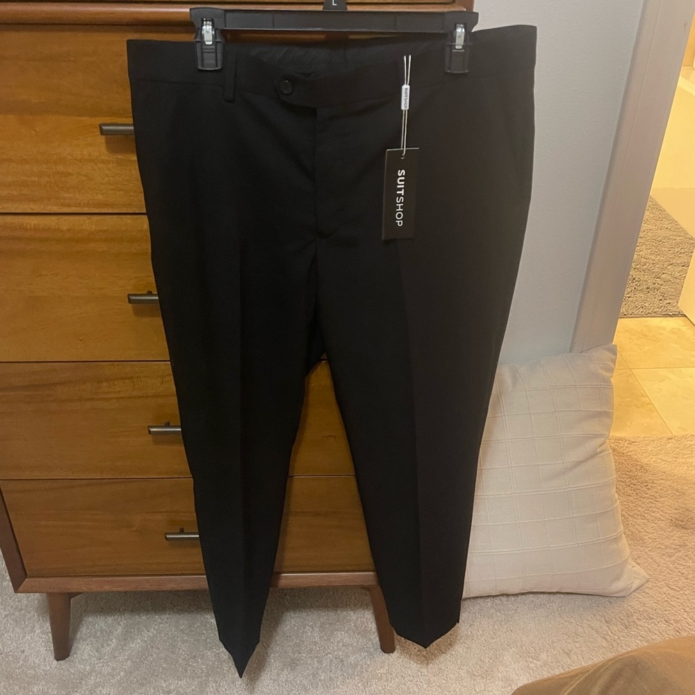 Women’s black dress pants.  SuitShop